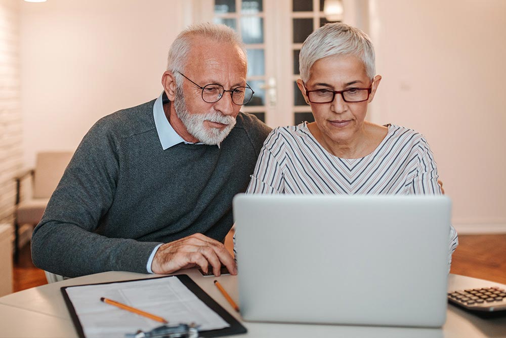 Trust And Estate Planning Couple At Computer