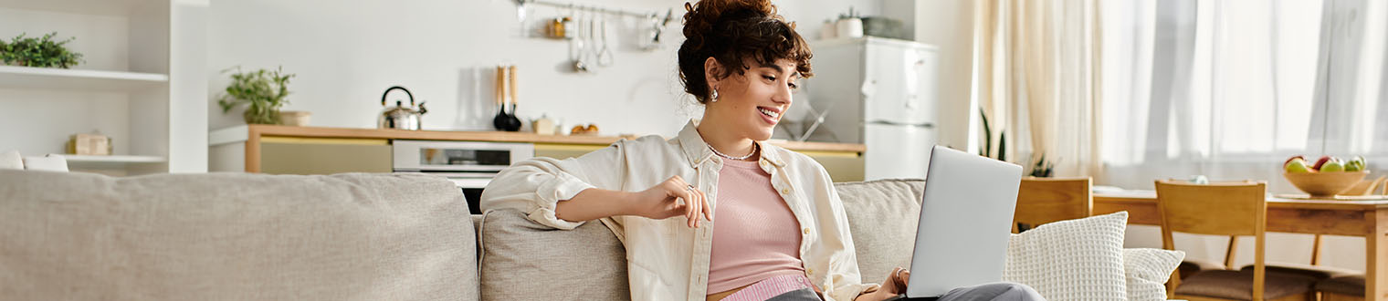 High-Yield Rewards Checking Account Bonus: woman smiling using laptop