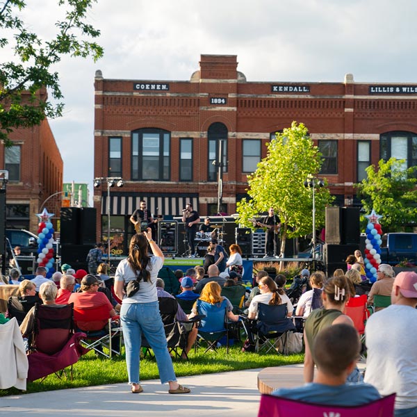Guests watch the Schmidt Brothers perform during night three of Marion by Moonlight in Central Plaza.